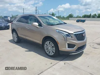 2022 Cadillac XT5 AWD Premium Luxury with VIN 1GYKNDRSXNZ112680, listed as a IAAI auction lot 42389521 with 12,365 mi miles and . Bid and sale history available at DreamBid. Image 1.