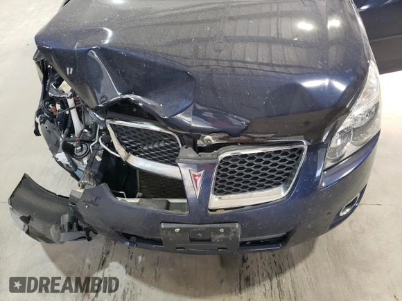 2010 Pontiac Vibe with VIN 5Y2SM6E07AZ403883, listed as a Copart auction lot 77337294 with 42,276 mi miles and Salvage Title. Bid and sale history available at carsss.com. Image 12.