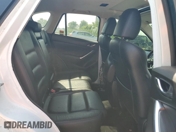 2016 Mazda CX-5 Grand Touring z VIN JM3KE4DY7G0864109, wystawiony jako Copart lot #59635865 z przebiegiem Nie podano mil oraz Czysty tytuł • Clean title. Historia ofert i sprzedaży dostępna na DreamBid. Obrazek 10.