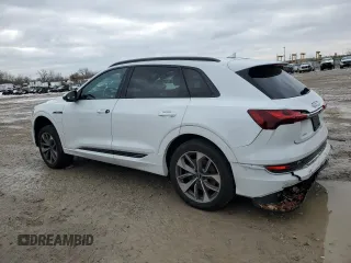 2021 Audi e-tron Premium Plus with VIN WA1LAAGE4MB003487, listed as a Copart auction lot 82790024 with 28,165 mi miles and Salvage title. Bid and sale history available at DreamBid. Image 2.