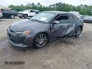 2015 Scion tC z VIN JTKJF5C75F3089895, wystawiony jako IAAI lot #42226465 z przebiegiem 106 694 mil mil oraz . Historia ofert i sprzedaży dostępna na DreamBid. Obrazek 2.