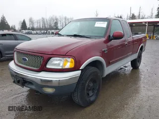 1999 Ford F-150 XL with VIN 2FTRX18L1XCA54790, listed as a IAAI auction lot 41556984 with 257,673 mi miles. Bid and sale history available at carsss.com. Image 2.