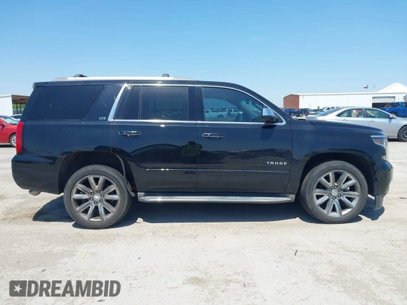 2015 Chevrolet Tahoe LTZ with VIN 1GNSCCKC4FR309152, listed as a IAAI auction lot 42029341 with 187,313 mi miles and . Bid and sale history available at DreamBid. Image 13.
