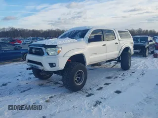 2014 Toyota Tacoma with VIN 3TMLU4EN0EM147193, listed as a IAAI auction lot 41280636 with 162,345 mi miles. Bid and sale history available at carsss.com. Image 2.