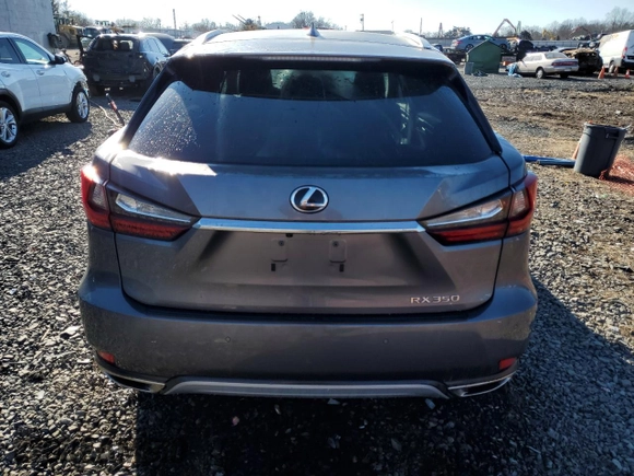 2021 Lexus RX with VIN 2T2HZMDA5MC293551, listed as a Copart auction lot 47297435 with 114,007 mi miles and Salvage Title. Bid and sale history available at carsss.com. Image 6.