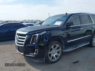 2015 Cadillac Escalade Luxury z VIN 1GYS4BKJ2FR260848, wystawiony jako IAAI lot #41895938 z przebiegiem 157 531 mil mil oraz . Historia ofert i sprzedaży dostępna na DreamBid. Obrazek 6.