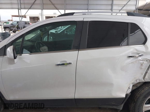 2020 Chevrolet Trax LT with VIN KL7CJLSBXLB010793, listed as a IAAI auction lot 41704879 with 124,915 mi miles and . Bid and sale history available at DreamBid. Image 14.