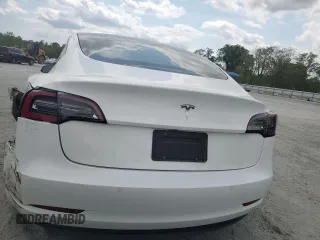 2021 Tesla Model 3 Standard Range Plus z VIN 5YJ3E1EAXMF973450, wystawiony jako Copart lot #52766645 z przebiegiem 66 827 mil mil oraz Szkoda całkowita • Salvage title. Historia ofert i sprzedaży dostępna na DreamBid. Obrazek 6.