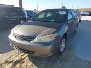 2004 Toyota Camry LE with VIN 4T1BE32KX4U916477, listed as a IAAI auction lot 42018299 with 149,247 mi miles. Bid and sale history available at carsss.com. Image 2.