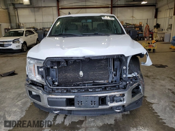 2019 Ford F-150 XL with VIN 1FTFW1E4XKFA16846, listed as a Copart auction lot 61345795 with 128,587 mi miles and Salvage title. Bid and sale history available at DreamBid. Image 5.