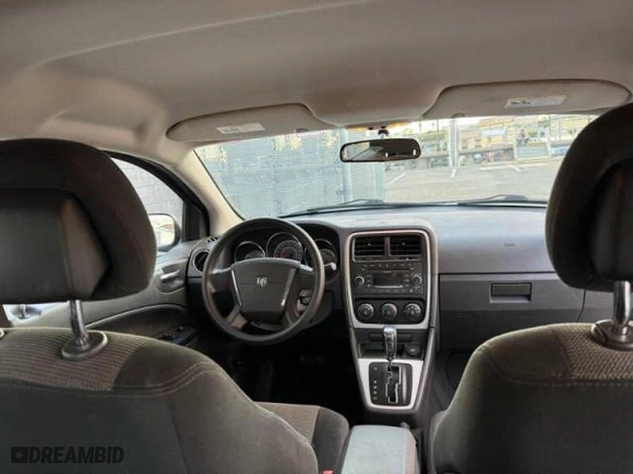 2010 Dodge Caliber SXT with VIN 1B3CB4HA1AD579409, listed as a Copart auction lot 49857695 with 100,311 mi miles and Clean Title. Bid and sale history available at carsss.com. Image 9.