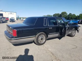 1997 Lincoln Town Car Signature with VIN 1LNLM82W0VY755395, listed as a Copart auction lot 60832324 with 143,323 mi miles and Salvage Title. Bid and sale history available at carsss.com. Image 3.