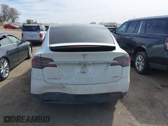 2018 Tesla Model X 75D with VIN 5YJXCBE27JF121834, listed as a IAAI auction lot 41769246 with 90,814 mi miles and . Bid and sale history available at carsss.com. Image 16.
