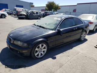 2001 BMW 3 Series 325Ci with VIN WBABN334X1JW49159, listed as a Copart auction lot 67799724 with 215,468 mi miles and Salvage Title. Bid and sale history available at carsss.com. Image 1.