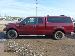 2005 Ford F-150 XLT with VIN 1FTPX12505FB69853, listed as a IAAI auction lot 42092756 with 330,699 mi miles. Bid and sale history available at carsss.com. Image 14.