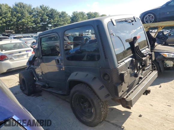 2002 Jeep Wrangler Sport with VIN 1J4FA49S72P715946, listed as a Copart auction lot 70884114 with 114,964 mi miles and Clean Title. Bid and sale history available at carsss.com. Image 2.