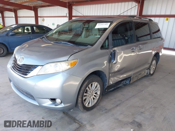 2011 Toyota Sienna XLE AAS with VIN 5TDYK3DC0BS107522, listed as a IAAI auction lot 42207305 with 171,857 mi miles and . Bid and sale history available at DreamBid. Image 2.