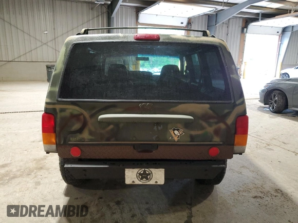 1998 Jeep Cherokee Sport with VIN 1J4FJ68S7WL269467, listed as a Copart auction lot 58664135 with 187,741 mi miles and Clean title. Bid and sale history available at DreamBid. Image 6.
