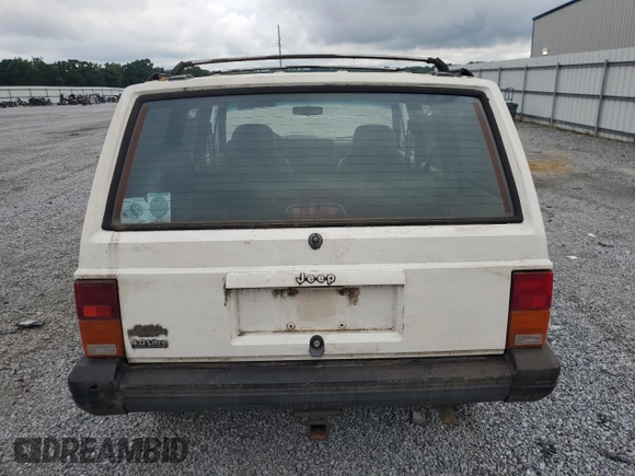 1996 Jeep Cherokee Sport z VIN 1J4FJ68S3TL103684, wystawiony jako Copart lot #63466265 z przebiegiem 163 715 mil mil oraz Czysty tytuł • Clean title. Historia ofert i sprzedaży dostępna na DreamBid. Obrazek 6.
