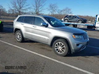 2014 Jeep Grand Cherokee Limited with VIN 1C4RJFBG1EC219721, listed as a IAAI auction lot 41754606 with 146,732 mi miles. Bid and sale history available at carsss.com. Image 1.
