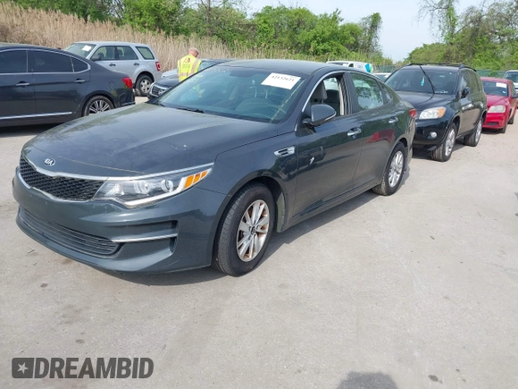 2016 Kia Optima LX with VIN KNAGT4L37G5073752, listed as a IAAI auction lot 42132621 with 136,818 mi miles. Bid and sale history available at carsss.com. Image 2.