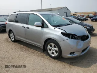 2014 Toyota Sienna L with VIN 5TDZK3DC8ES442973, listed as a Copart auction lot 59660055 with 310,496 mi miles and Salvage title. Bid and sale history available at DreamBid. Image 4.