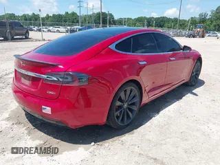 2016 Tesla Model S 90D with VIN 5YJSA1E48GF144821, listed as a IAAI auction lot 42206473 with 129,624 mi miles and . Bid and sale history available at DreamBid. Image 4.