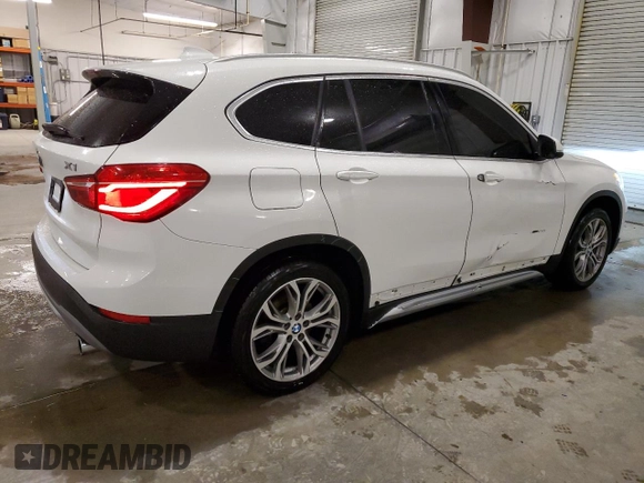 2018 BMW X1 xDrive28i with VIN WBXHT3C30J5K29917, listed as a Copart auction lot 56165845 with 131,876 mi miles and Salvage title. Bid and sale history available at DreamBid. Image 3.