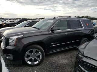 2017 GMC Yukon Denali with VIN 1GKS2CKJ3HR360319, listed as a Copart auction lot 70051014 with 127,896 mi miles and Salvage Title. Bid and sale history available at carsss.com. Image 1.