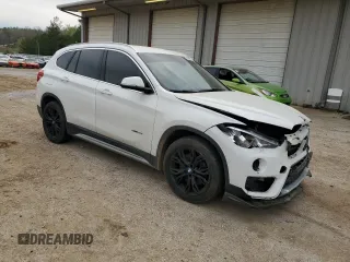 2017 BMW X1 sDrive28i with VIN WBXHU7C30H5H38049, listed as a Copart auction lot 51007915 with 52,963 mi miles and Salvage Title. Bid and sale history available at carsss.com. Image 4.