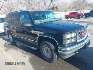1997 GMC Yukon with VIN 1GKEK13R3VJ759103, listed as a IAAI auction lot 41726127 with 218,500 mi miles. Bid and sale history available at carsss.com. Image 1.