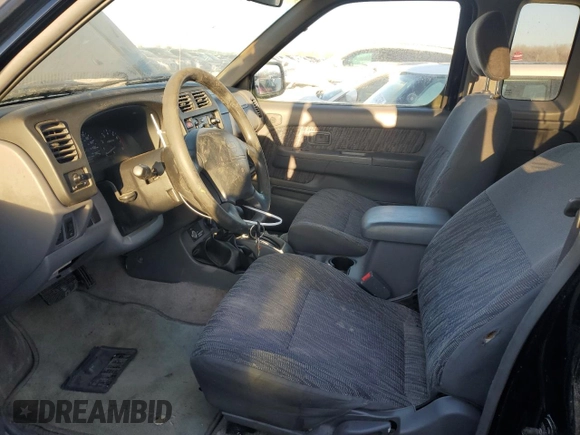 1999 Nissan Frontier XE with VIN 1N6ED26Y4XC322021, listed as a Copart auction lot 82690214 with 102,758 mi miles and Clean title. Bid and sale history available at DreamBid. Image 7.