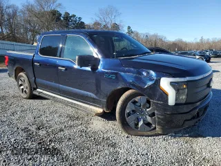 2024 Ford F-150 Lightning XLT with VIN 1FTVW3LK1RWG18473, listed as a Copart auction lot 86523084 with 6,824 mi miles and Salvage title. Bid and sale history available at DreamBid. Image 4.
