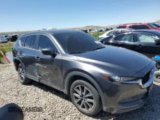 2018 Mazda CX-5 Touring z VIN JM3KFACM5J0338126, wystawiony jako Copart lot #56185795 z przebiegiem 115 254 mil mil oraz Szkoda całkowita • Salvage title. Historia ofert i sprzedaży dostępna na DreamBid. Obrazek 4.