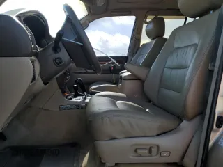 1999 Lexus LX 470 z VIN JT6HT00W1X0045075, wystawiony jako Copart lot #55684785 z przebiegiem 168 855 mil mil oraz Szkody całkowita. Historia ofert i sprzedaży dostępna na DreamBid. Obrazek 7.