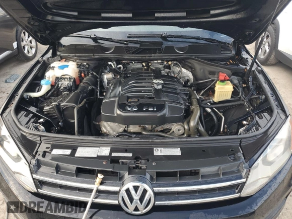 2012 Volkswagen Touareg Exec with VIN WVGEF9BP1CD011407, listed as a Copart auction lot 79199754 with 57,376 mi miles and Salvage Title. Bid and sale history available at DreamBid. Image 12.