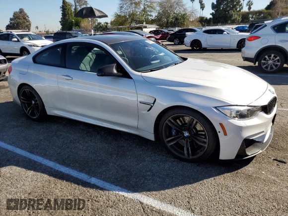 2015 BMW M4 with VIN WBS3R9C55FK330561, listed as a Copart auction lot 40490133 with 65,127 mi miles. Bid and sale history available at carsss.com. Image 4.