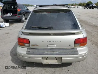 1999 Subaru Impreza L with VIN JF1GF4351XH815210, listed as a Copart auction lot 71250504 with 141,806 mi miles and Salvage title. Bid and sale history available at DreamBid. Image 6.