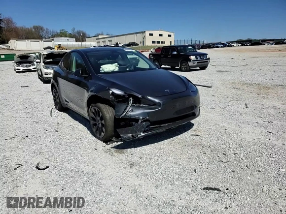 2025 Tesla Model Y Long Range with VIN 7SAYGAEEXSF253326, listed as a Copart auction lot 49527965 with 5,803 mi miles and Salvage Title. Bid and sale history available at DreamBid. Image 11.