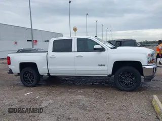 2018 Chevrolet Silverado 1500 LT with VIN 3GCPCREC7JG402401, listed as a IAAI auction lot 41880462 with 128,995 mi miles and . Bid and sale history available at DreamBid. Image 13.