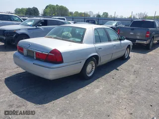 2002 Mercury Grand Marquis LS Premium with VIN 2MEFM75W02X660966, listed as a IAAI auction lot 41869806 with 133,758 mi miles. Bid and sale history available at carsss.com. Image 4.
