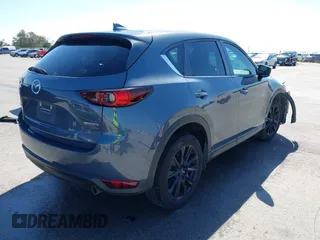 2021 Mazda CX-5 Touring with VIN JM3KFACM1M0317763, listed as a IAAI auction lot 41775712 with 75,068 mi miles. Bid and sale history available at carsss.com. Image 4.