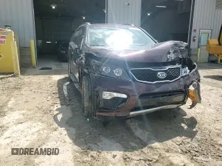 2012 Kia Sorento SX z VIN 5XYKWDA29CG301363, wystawiony jako Copart lot #55954815 z przebiegiem 83 206 mil mil oraz Szkoda całkowita • Salvage title. Historia ofert i sprzedaży dostępna na DreamBid. Obrazek 14.