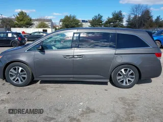 2016 Honda Odyssey Touring Elite with VIN 5FNRL5H90GB128006, listed as a IAAI auction lot 41695438 with 133,337 mi miles. Bid and sale history available at carsss.com. Image 14.