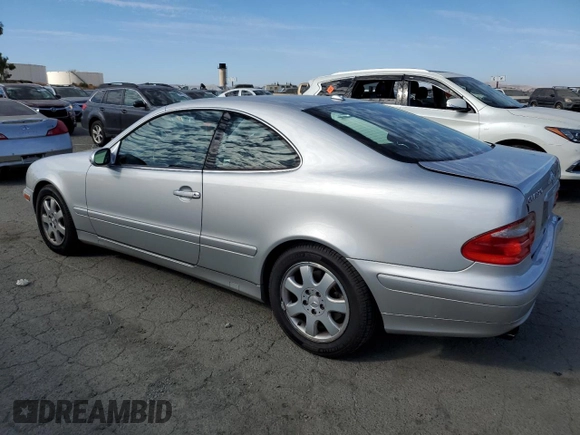 2000 Mercedes-Benz CLK 320/430 with VIN WDBLJ65G8YF122308, listed as a Copart auction lot 77449314 with 105,121 mi miles and Salvage Title. Bid and sale history available at DreamBid. Image 2.