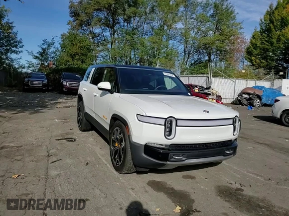 2024 Rivian R1S Adventure z VIN 7PDSGABAXRN035766, wystawiony jako Copart lot #77481034 z przebiegiem 6 590 mil mil oraz Szkoda całkowita • Salvage title. Historia ofert i sprzedaży dostępna na DreamBid. Obrazek 11.
