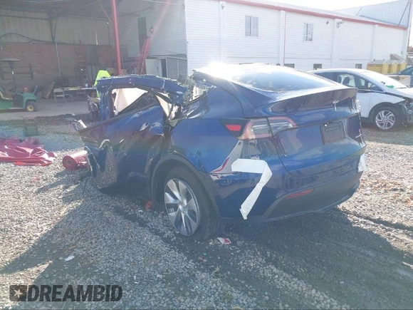 2024 Tesla Model Y Long Range with VIN 7SAYGDEEXRA265159, listed as a IAAI auction lot 40907008 with Not Provided miles and . Bid and sale history available at DreamBid. Image 3.
