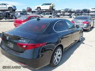 2021 Alfa Romeo Giulia Ti Sport with VIN ZARFAMBN2M7649941, listed as a IAAI auction lot 41912686 with 77,626 mi miles. Bid and sale history available at carsss.com. Image 4.