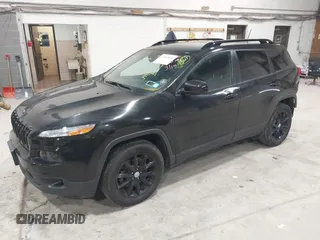 2014 Jeep Cherokee Latitude with VIN 1C4PJMCS6EW299532, listed as a IAAI auction lot 41833888 with 199,915 mi miles and . Bid and sale history available at DreamBid. Image 2.