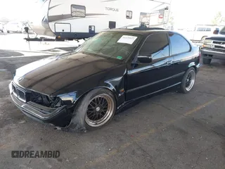 1996 BMW 3-Series 318TI with VIN WBACG8324TAU38424, listed as a IAAI auction lot 41529537 with 160,199 mi miles. Bid and sale history available at carsss.com. Image 2.